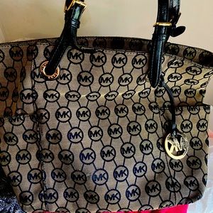 Michel Kors tan and black tote.